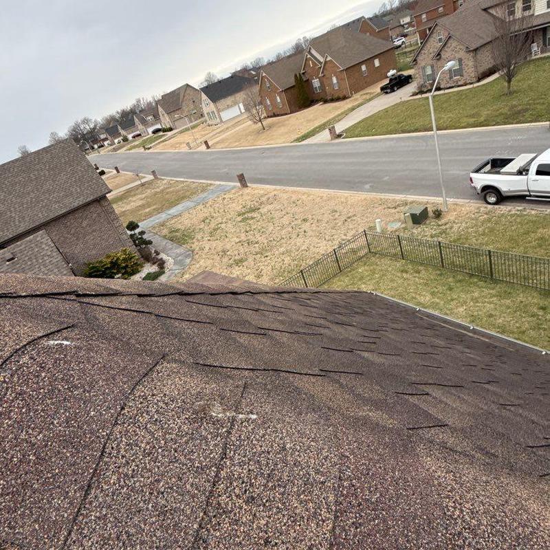 Asphalt shingle roof hail damage inspection in neighborhood