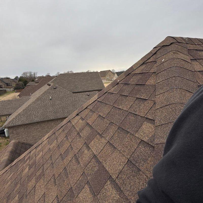 Asphalt shingle roof with ridge and flashing inspection