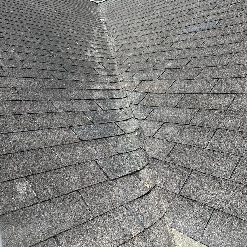 Roof valley flashing with asphalt shingles close-up