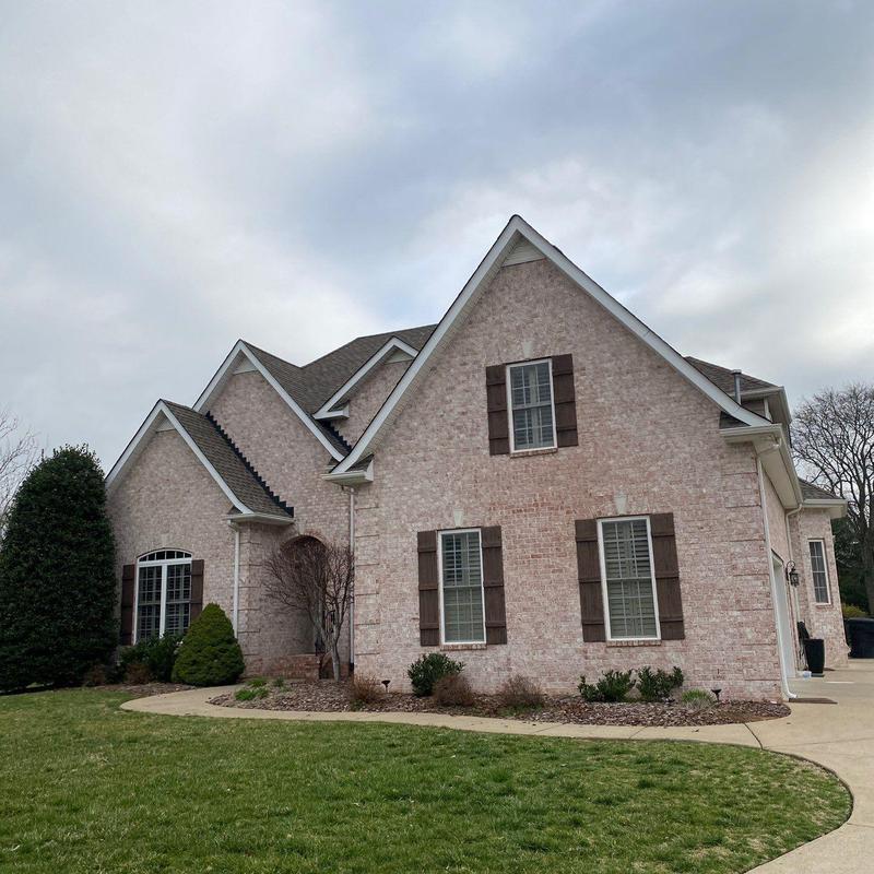 Roof shingles with hail damage on residential home