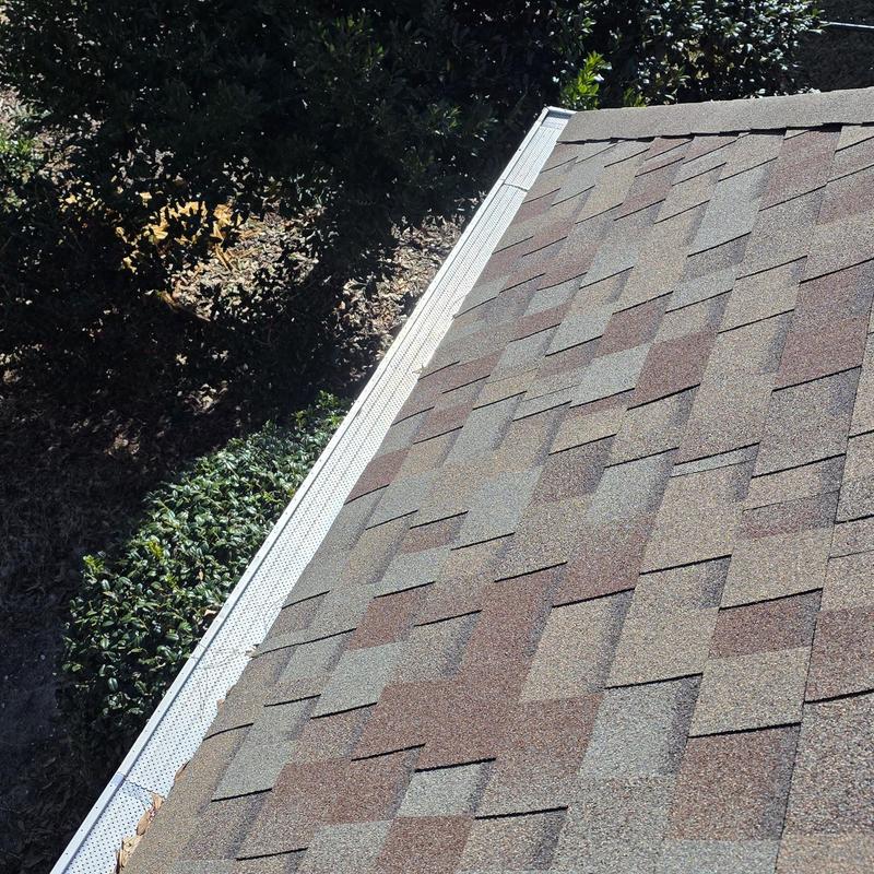 Asphalt shingle roof with metal drip edge installation