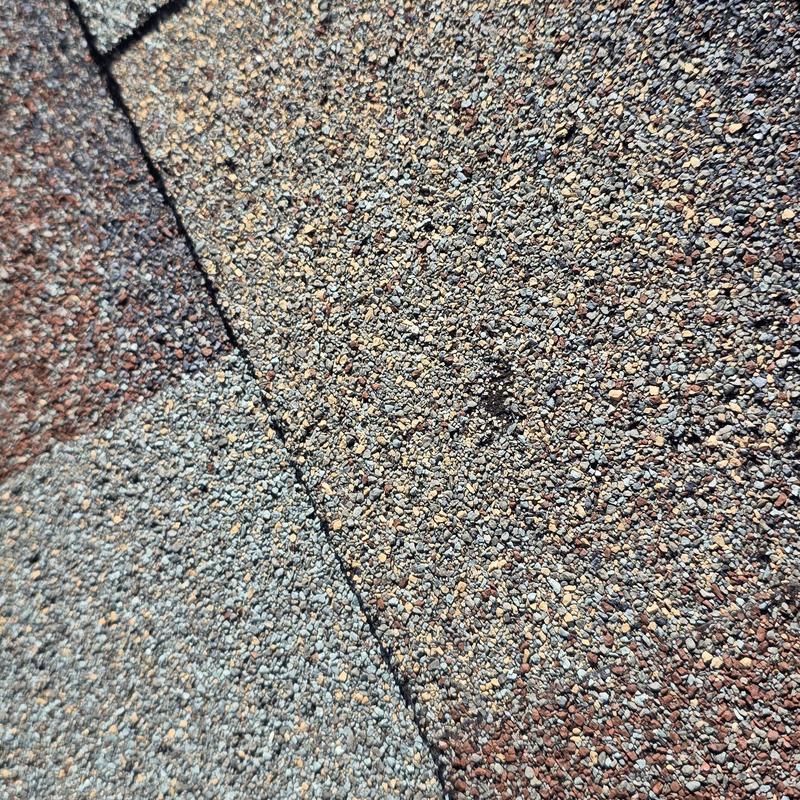 Asphalt shingles close-up with granule texture