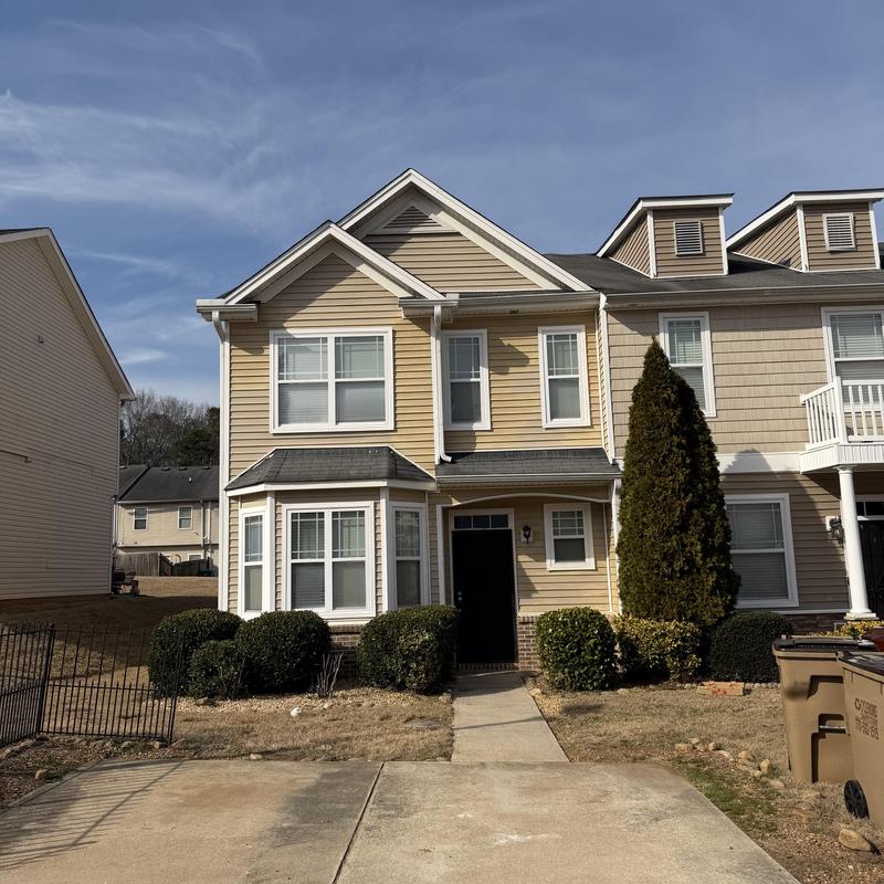 3-tab roof with tarps and damaged shingles