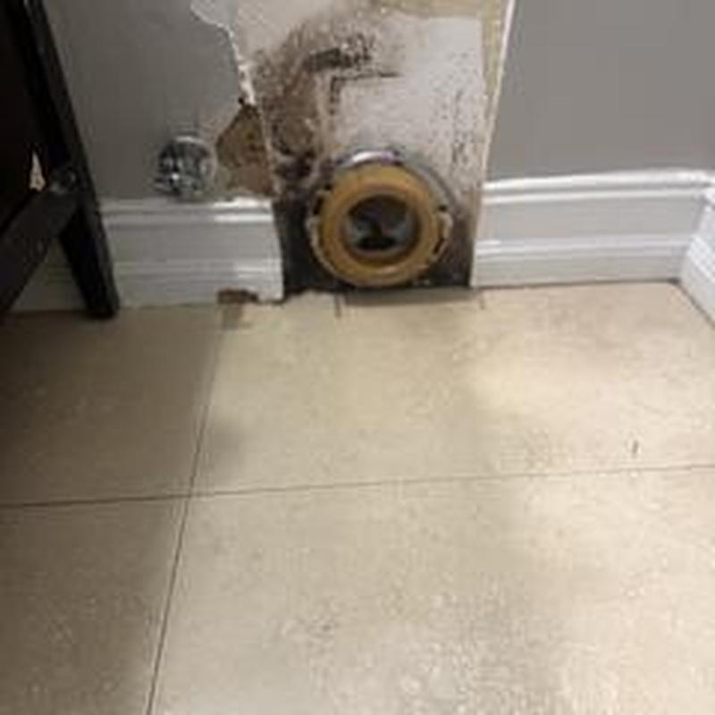 Floor-mounted toilet flange with damaged wall area