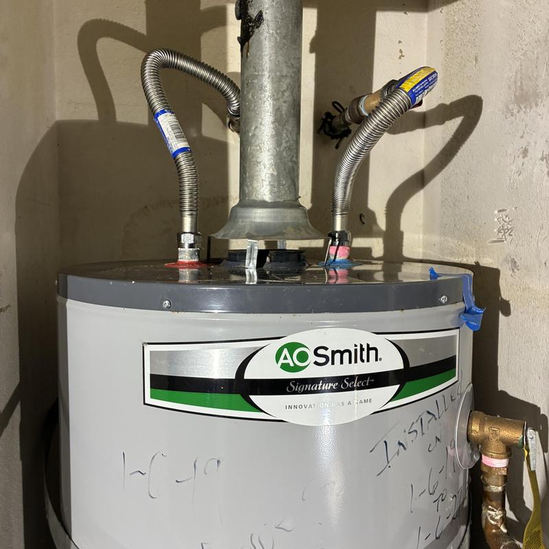 Water heater with old broken ball valve leak