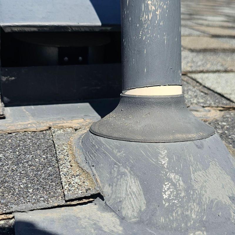 Shingle roof pipe jack with cracked sealant and damage Shingle roof pipe jack with cracked sealant and damage