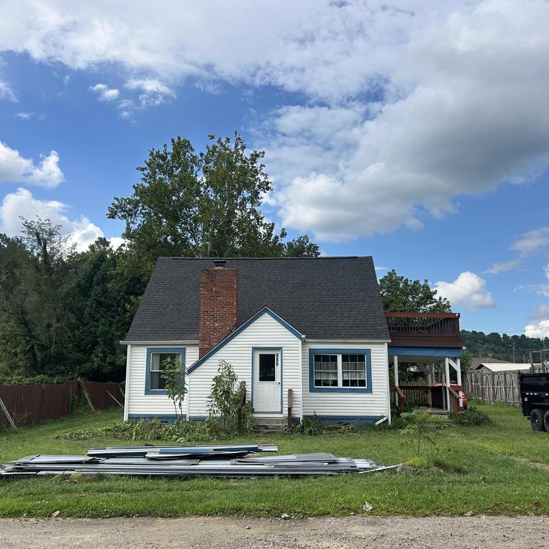 Black Shadow asphalt shingle roof on white house