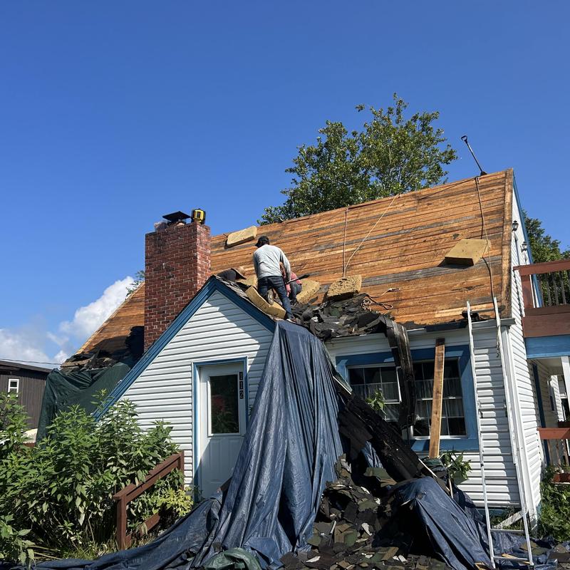 Black Shadow shingle removal and roof decking exposed