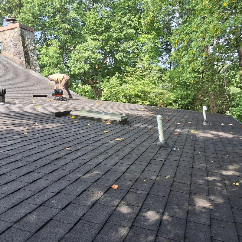 Weathered Shadow shingle roof with vents and skylight