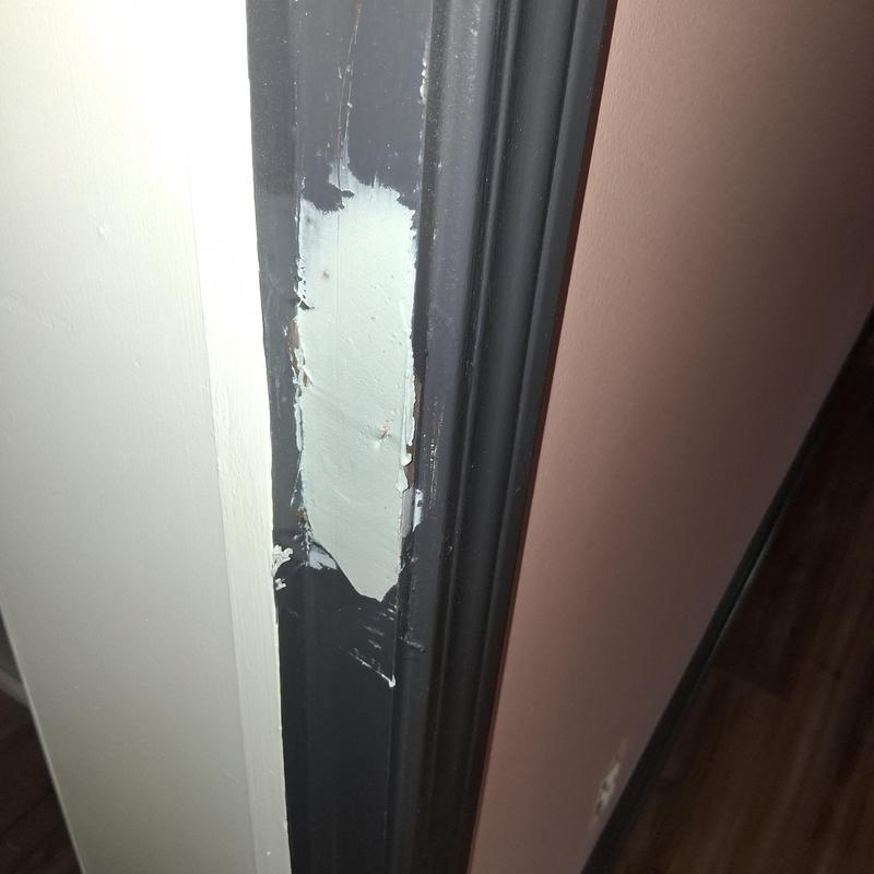 Door latch plate area with patch paint on frame Door latch plate area with patch paint on frame