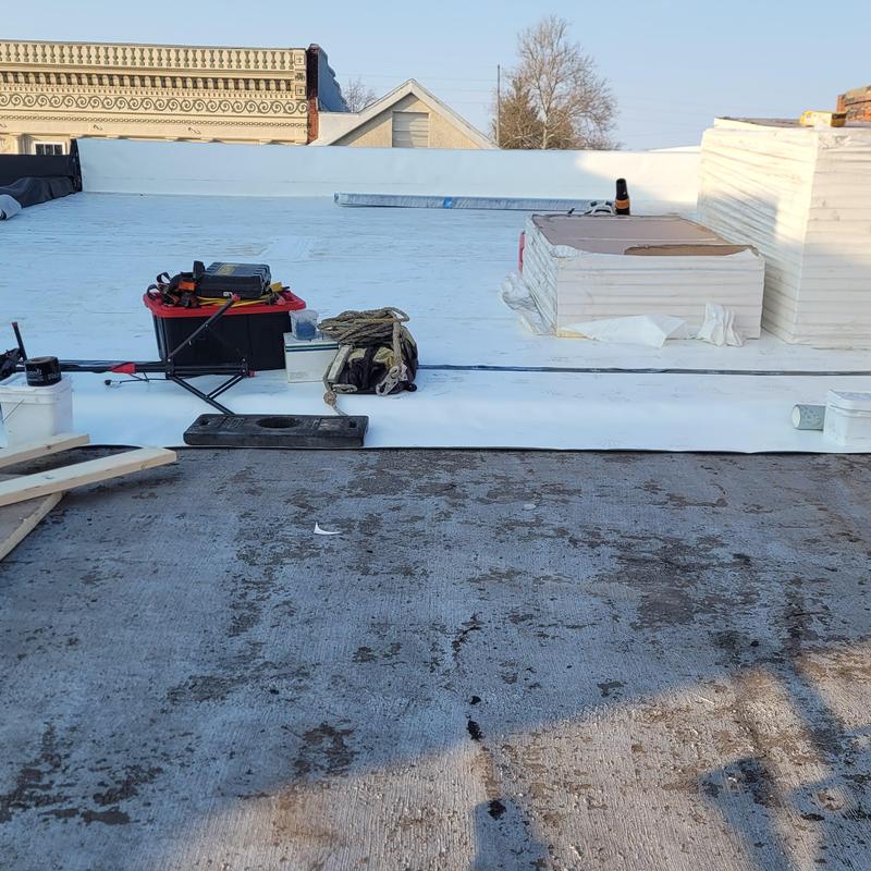 Single ply roofing installation with tools and materials