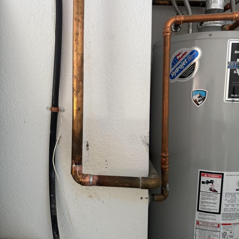 Copper water line loop installed by water heater