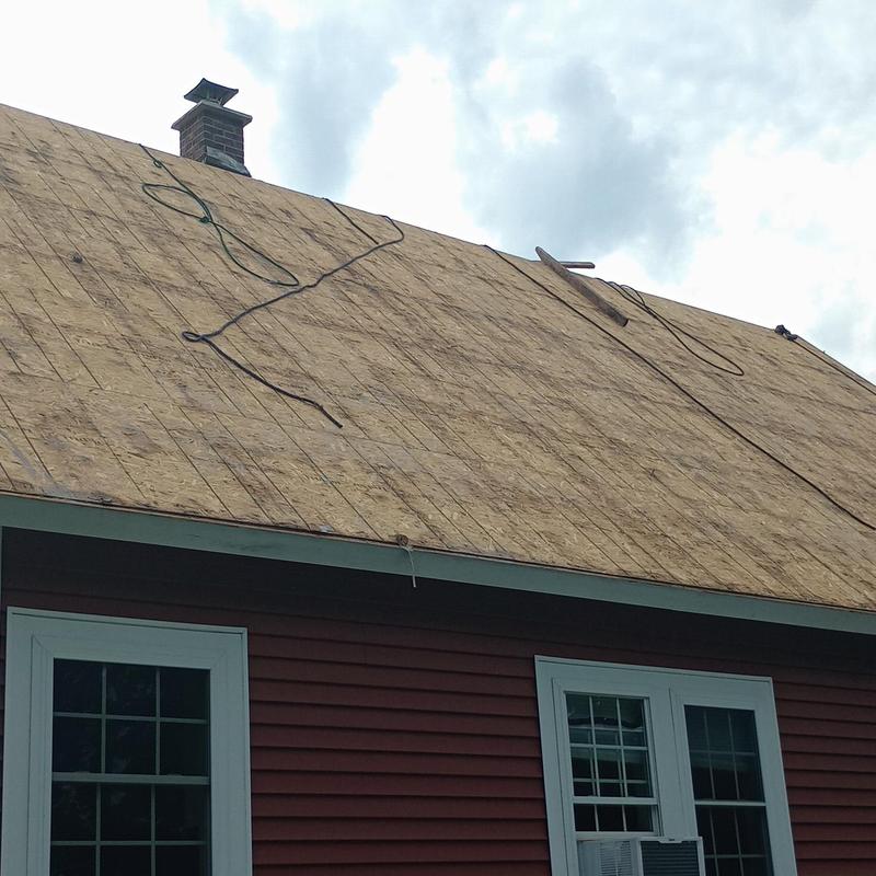 Plywood roof decking installation on residential house