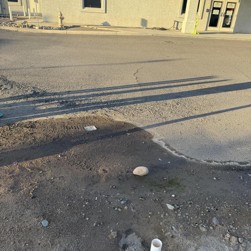 PVC water main line break with water pooling on street