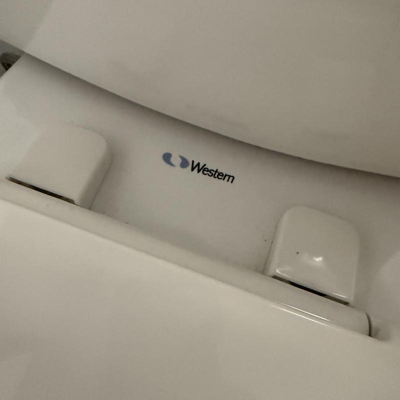 Western Pottery toilet close-up with logo visible