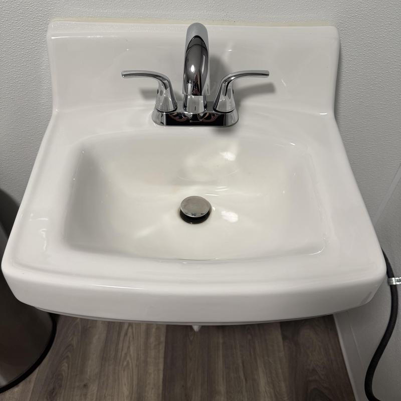 Bathroom sink with chrome faucet and drain stopper