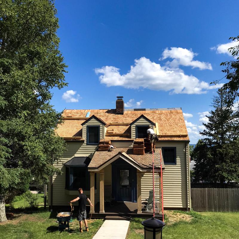 Cedar shake roof installation on residential home Cedar shake roof installation on residential home