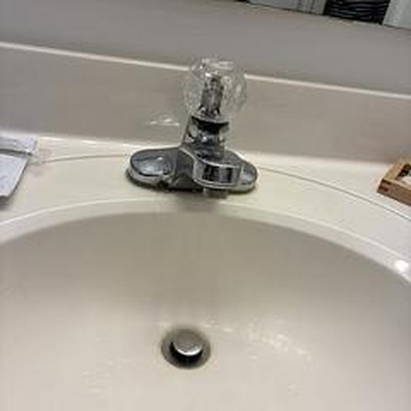 Lavatory faucet with clear knob and sink drain