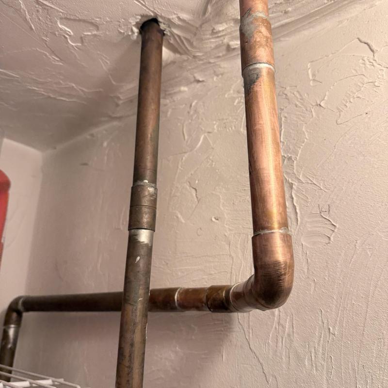 Copper water piping with replacement joints near ceiling