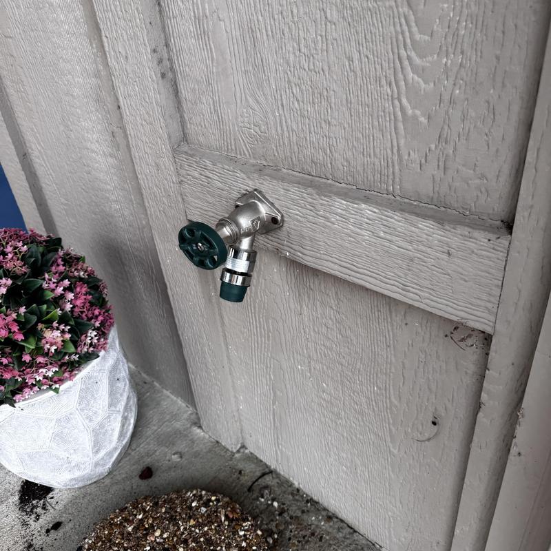 Frost-proof hose bib with attached hose connector