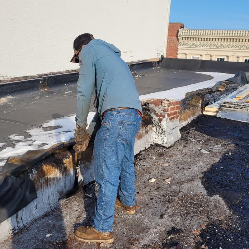 Flat roof membrane removal and preparation for new roofing