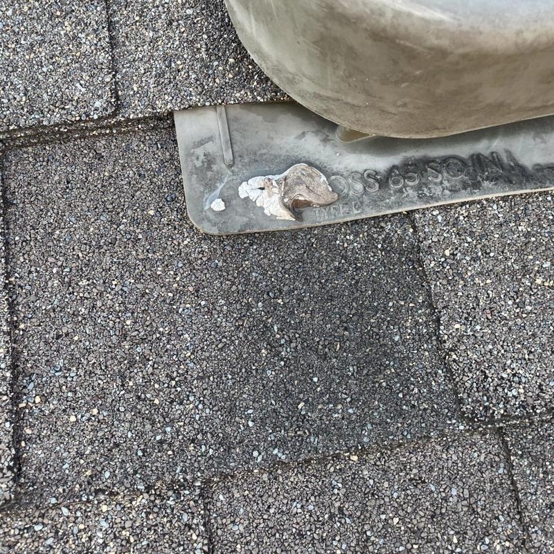 Roof vent and flashing on asphalt shingle roof