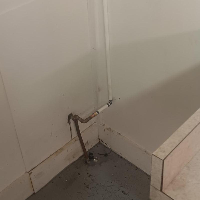 Copper and PEX water repipe in basement corner