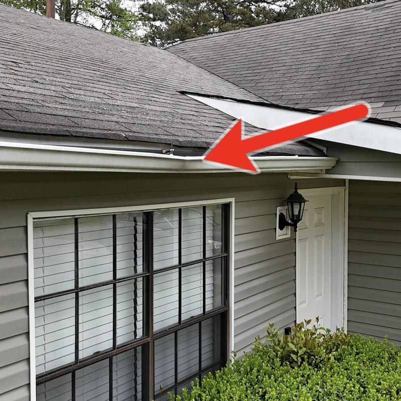 Gutter replacement and roof shingle repair on house front