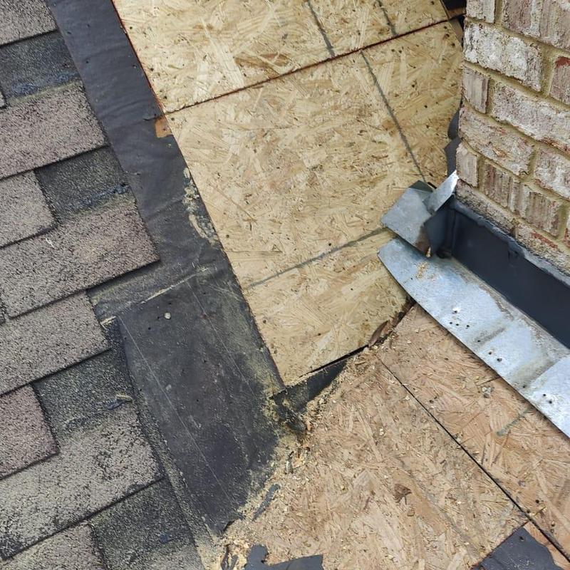 Roof decking and flashing near chimney replacement