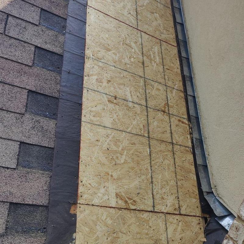 Decking boards replacement on roof near wall flashing