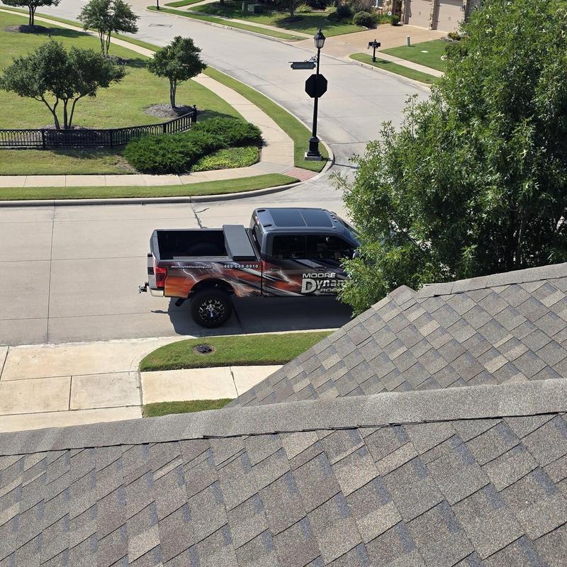 Asphalt shingle roof with hail and wind damage