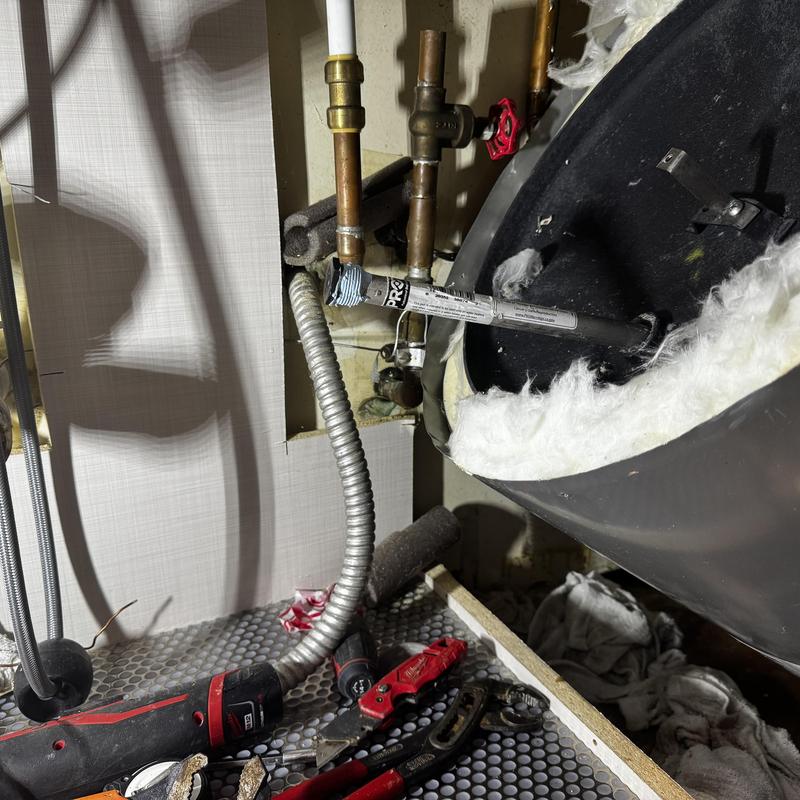 Electric hot water heater anode rod replacement under sink