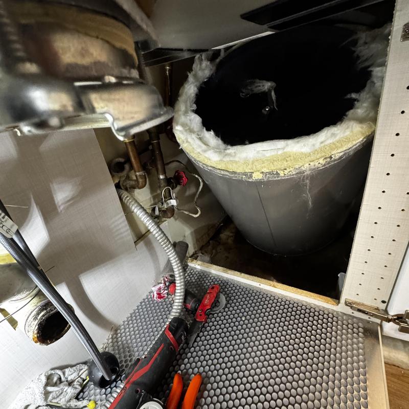 Electric water heater tank with insulation removed