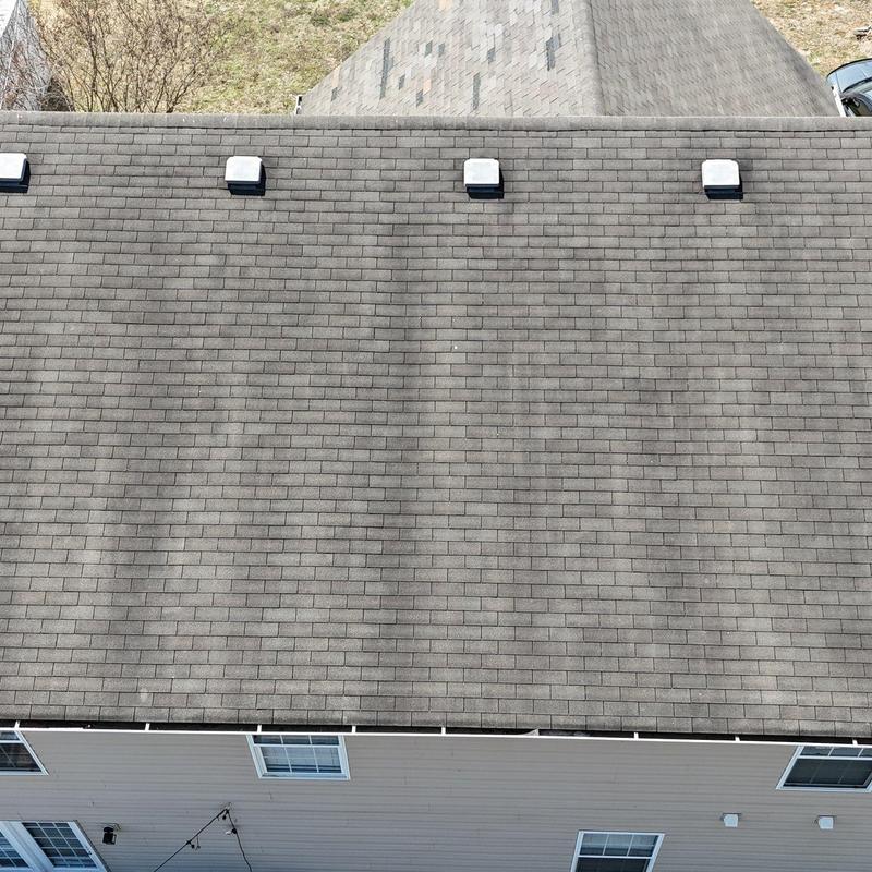 Asphalt shingle roof with hail damage inspection