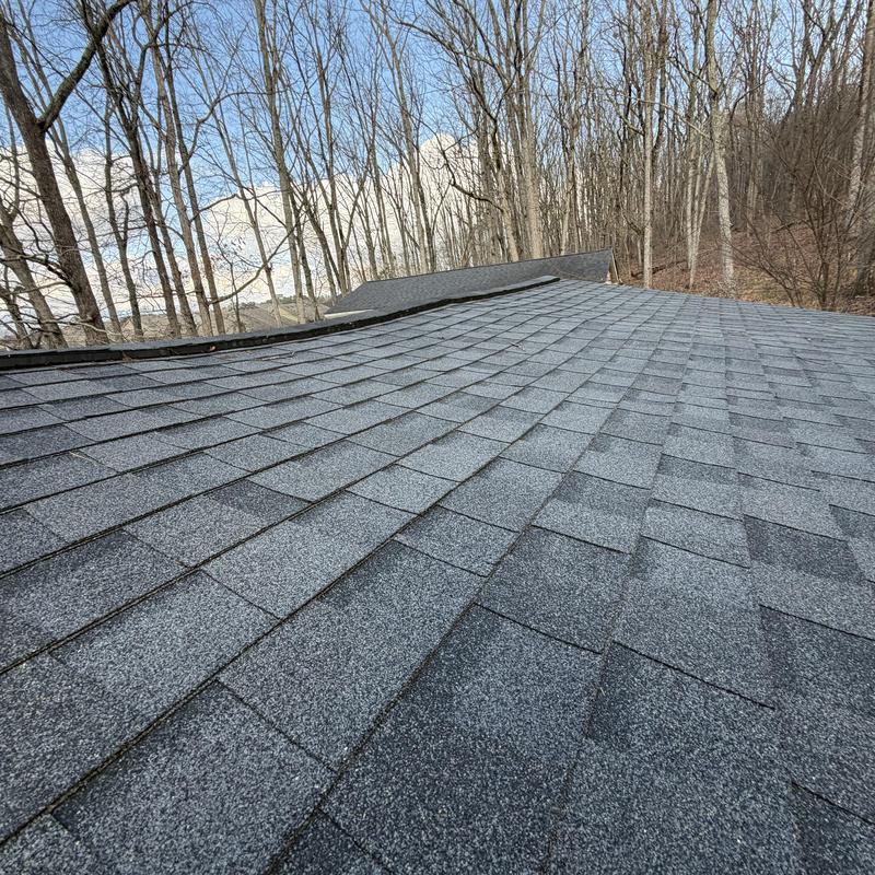 Roof decking with visible dip and loose boards