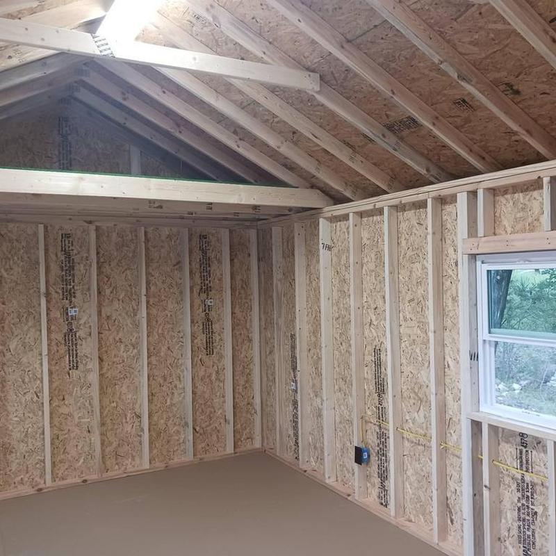 Wall and ceiling insulation installation in work shed