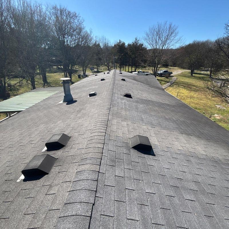 Asphalt shingle roof with vents and ridge cap
