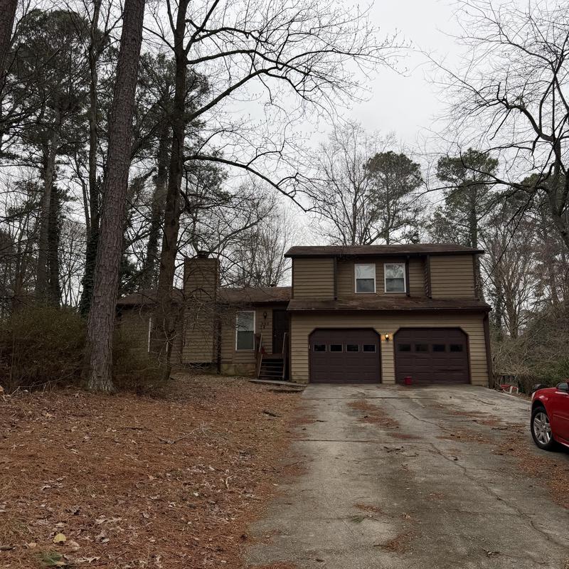 Box vents and pipe boot on 2-story golden cedar roof