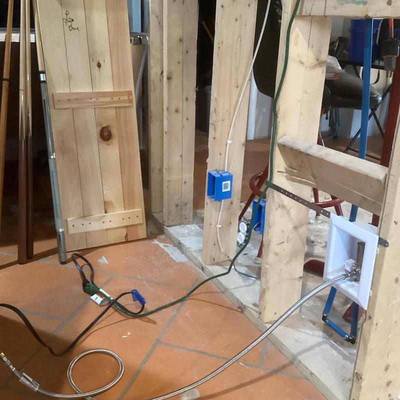 Ice maker box installation with supply line connections