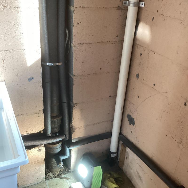 Cast iron kitchen drain and PEX plumbing lines installation