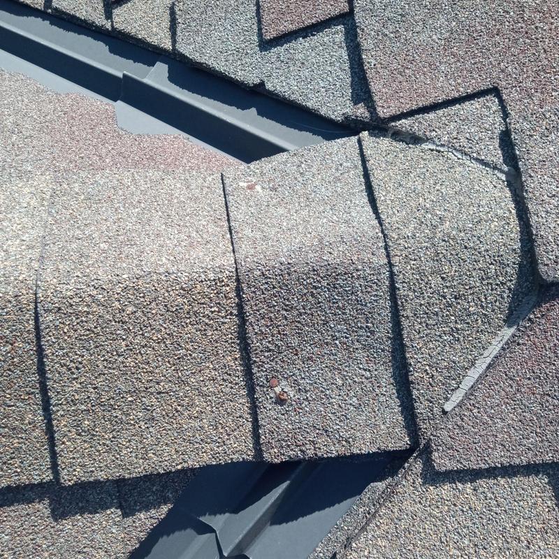 Asphalt shingle roof with overlap and flashing detail Asphalt shingle roof with overlap and flashing detail