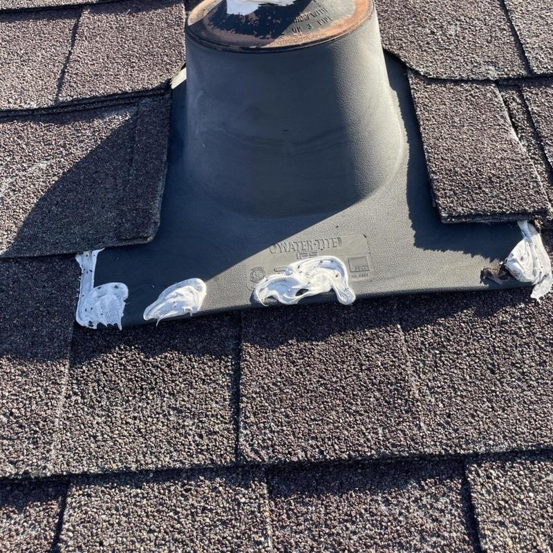 Pipe jack flashing with sealant on asphalt shingles