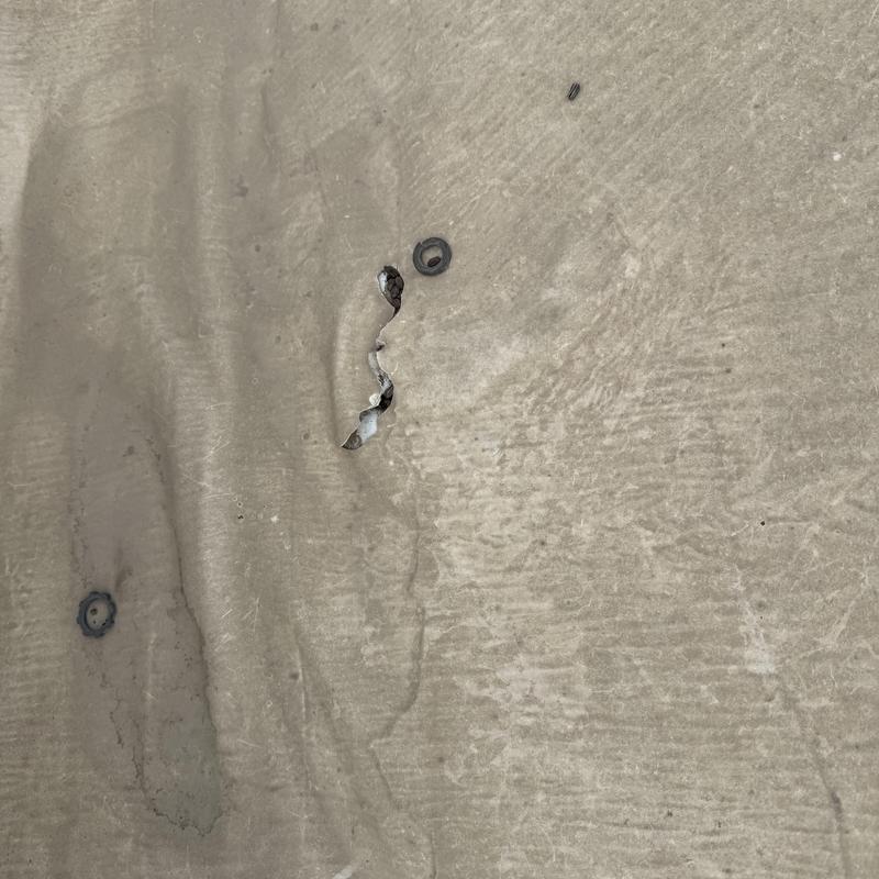 TPO Roof membrane with puncture damage and fasteners