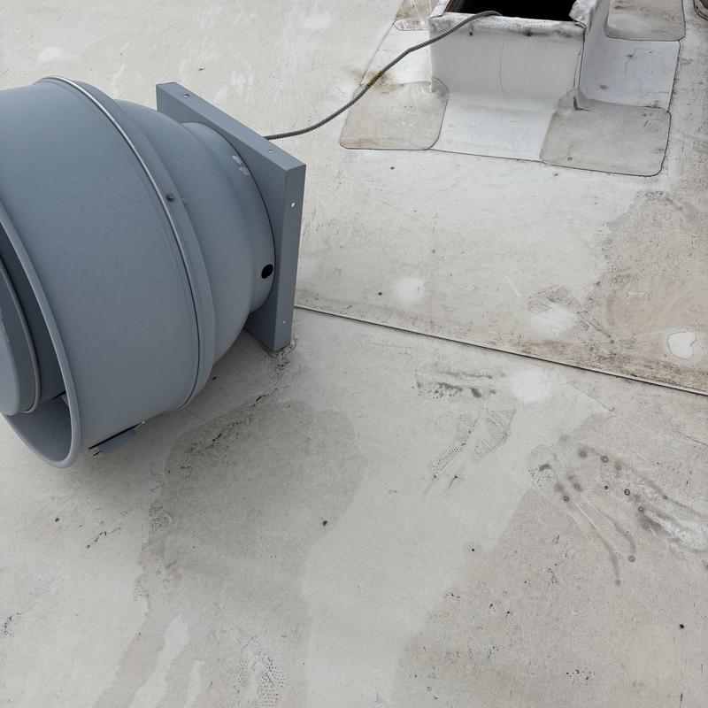 TPO roof vent and pipe flashing on commercial roof