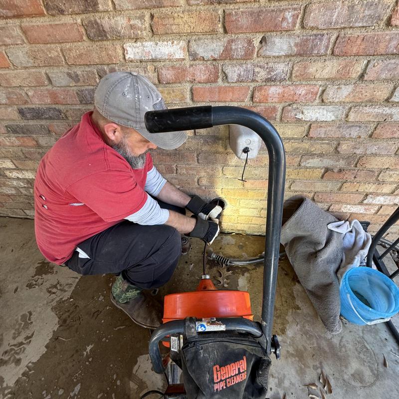 Washing machine drain pipe cleaning in brick wall area
