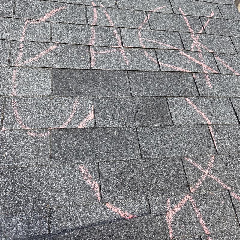 Asphalt shingles with chalk damage markings