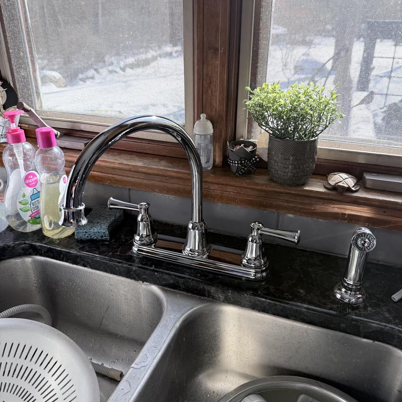 Kitchen faucet with sprayer on granite countertop Kitchen faucet with sprayer on granite countertop