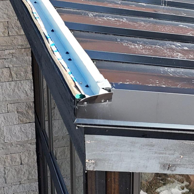 Standing seam metal roof edge with gutter system