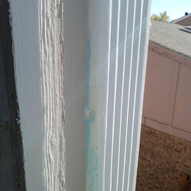 Wood window frame with painted damage and markings Wood window frame with painted damage and markings