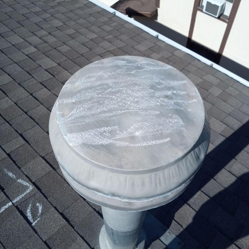 Roof vent cap with hail damage on shingle roof Roof vent cap with hail damage on shingle roof